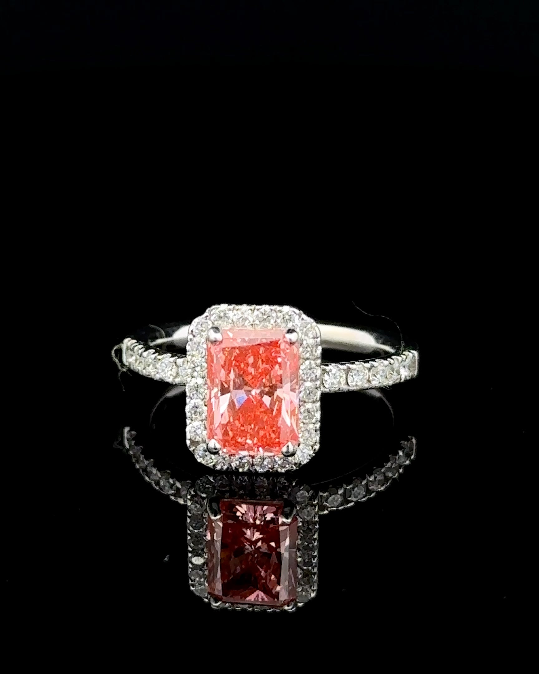 1.71 carat radiant fancy vivid pink halo lab grown diamond statement ring in 14K white gold