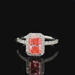 1.71 carat radiant fancy vivid pink halo lab grown diamond statement ring in 14K white gold.